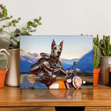 Load image into Gallery viewer, Portrait of a biker dog with a human body riding a motorcycle stands on a wooden table near cacti