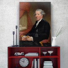 Load image into Gallery viewer, On a shelf against a gray wall is a portrait of a man dressed in a black royal suit