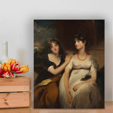 Load image into Gallery viewer, Portrait of two women dressed in regal attires standing on a wooden floor near flowers