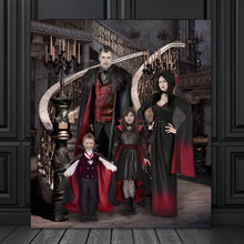 Load image into Gallery viewer, Portrait of a vampire family dressed in historical clothes stands on a black wooden floor near a black wall
