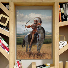 Load image into Gallery viewer, A portrait of a man sitting on a horse dressed in an American Indian costume hangs on the wall near the shelves
