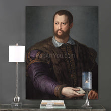 Load image into Gallery viewer, A portrait of a man dressed in historical royal attire with fur hangs on a gray wall above a candle