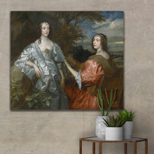 Load image into Gallery viewer, Portrait of two women dressed in royal clothes hanging on a beige wall near cacti