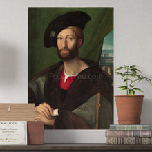 Load image into Gallery viewer, A portrait of a man dressed in regal clothes with a hat hangs on a white wall next to a pot of flowers