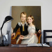 Load image into Gallery viewer, Portrait of two children dressed in historical royal clothes stands on a wooden table near a lamp and books