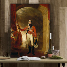 Load image into Gallery viewer, A portrait of a man dressed in a red royal suit stands on the table next to ya book