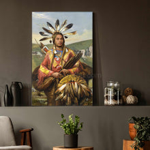 Load image into Gallery viewer, A portrait of a man dressed in an American Indian costume with a fur coat stands on a gray table next to a flower
