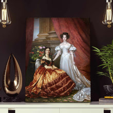Load image into Gallery viewer, Portrait of two women dressed in white and bronze dresses stands on a white table near two light bulbs