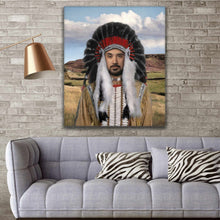 Load image into Gallery viewer, A portrait of a man dressed in American Indian clothing hangs on the brick wall above the sofa