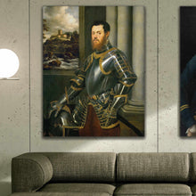 Load image into Gallery viewer, A portrait of a man dressed in historical royal clothes hangs on a gray wall above a gray sofa