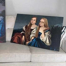 Load image into Gallery viewer, Portrait of two girls dressed in red and blue royal dresses lies on a gray sofa