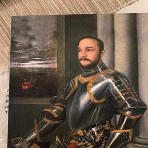 On the floor is a portrait of a man dressed in a historical royal suit with armor