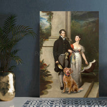 Load image into Gallery viewer, Portrait of a couple dressed in historical royal clothes standing near their dog stands on a white table near a golden vase