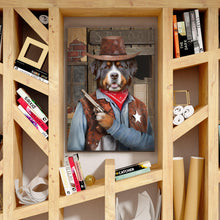Load image into Gallery viewer, Portrait of a dog with a human body dressed in historical cowboy clothes with a hat stands on a wooden shelf near books
