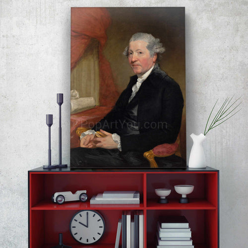 On a shelf against a gray wall is a portrait of a man dressed in a black royal suit
