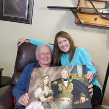 Load image into Gallery viewer, An elderly couple holding a portrait of themselves dressed in golden royal attires
