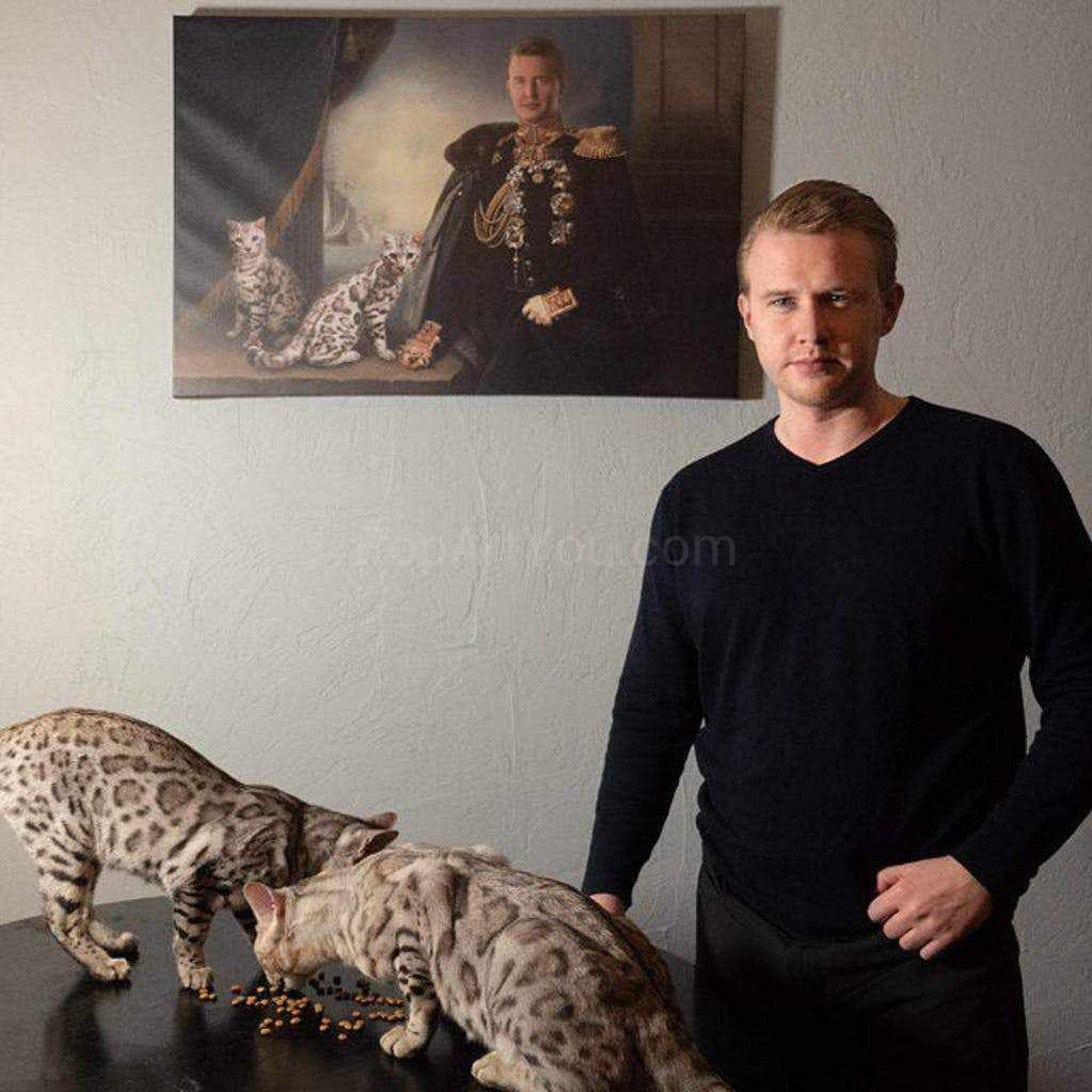 A man with cats stands in front of their portrait in royal clothes