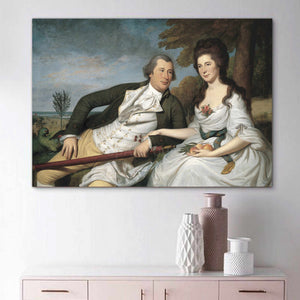 Portrait of a couple dressed in historical royal attires hangs on a white wall above three vases