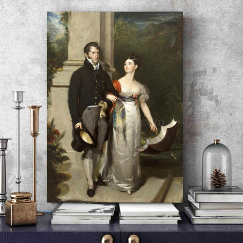 Portrait of a couple dressed in historical royal clothes stands on a blue table near books