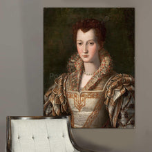 Load image into Gallery viewer, Portrait of a woman with red hair dressed in regal attire hangs on a gray wall near a white chair

