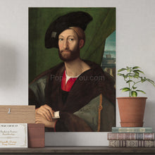 Load image into Gallery viewer, A portrait of a man dressed in regal clothes with a hat hangs on a white wall next to a pot of flowers
