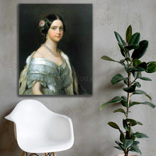 Load image into Gallery viewer, Portrait of a woman with dark hair dressed in royal attire hangs on a gray wall over a white chair
