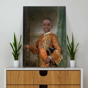 A portrait of a boy dressed in a bronze royal attire stands on a white cabinet near two cacti