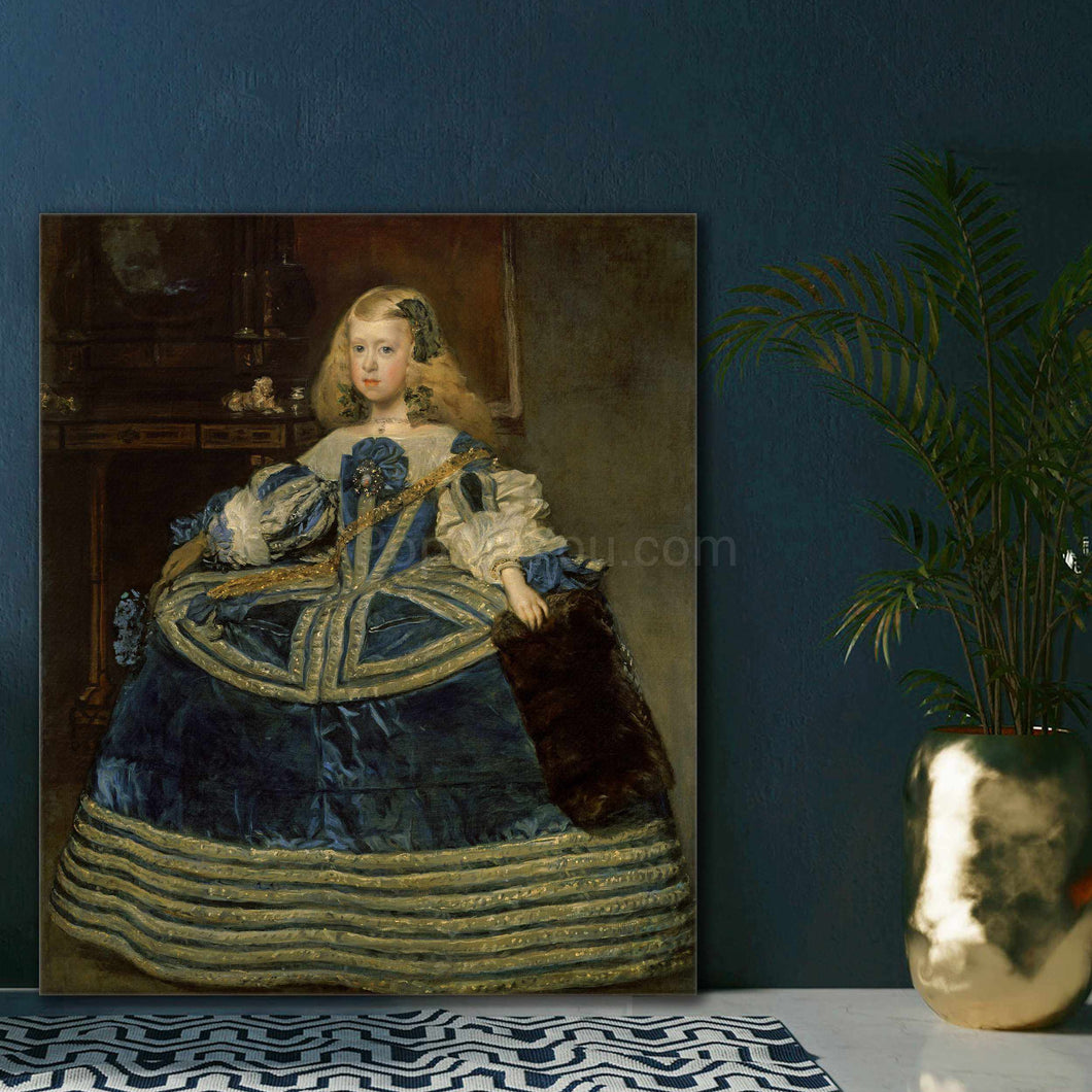 Portrait of a little girl dressed in historical royal clothes stands on a white table near a golden vase