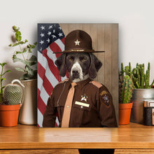 Load image into Gallery viewer, Portrait of a dog with a hat dressed in a brown sheriff&#39;s clothes stands on a wooden table near cacti
