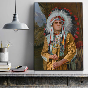 A portrait of a man dressed in an American Indian costume stands on a gray table next to notebooks
