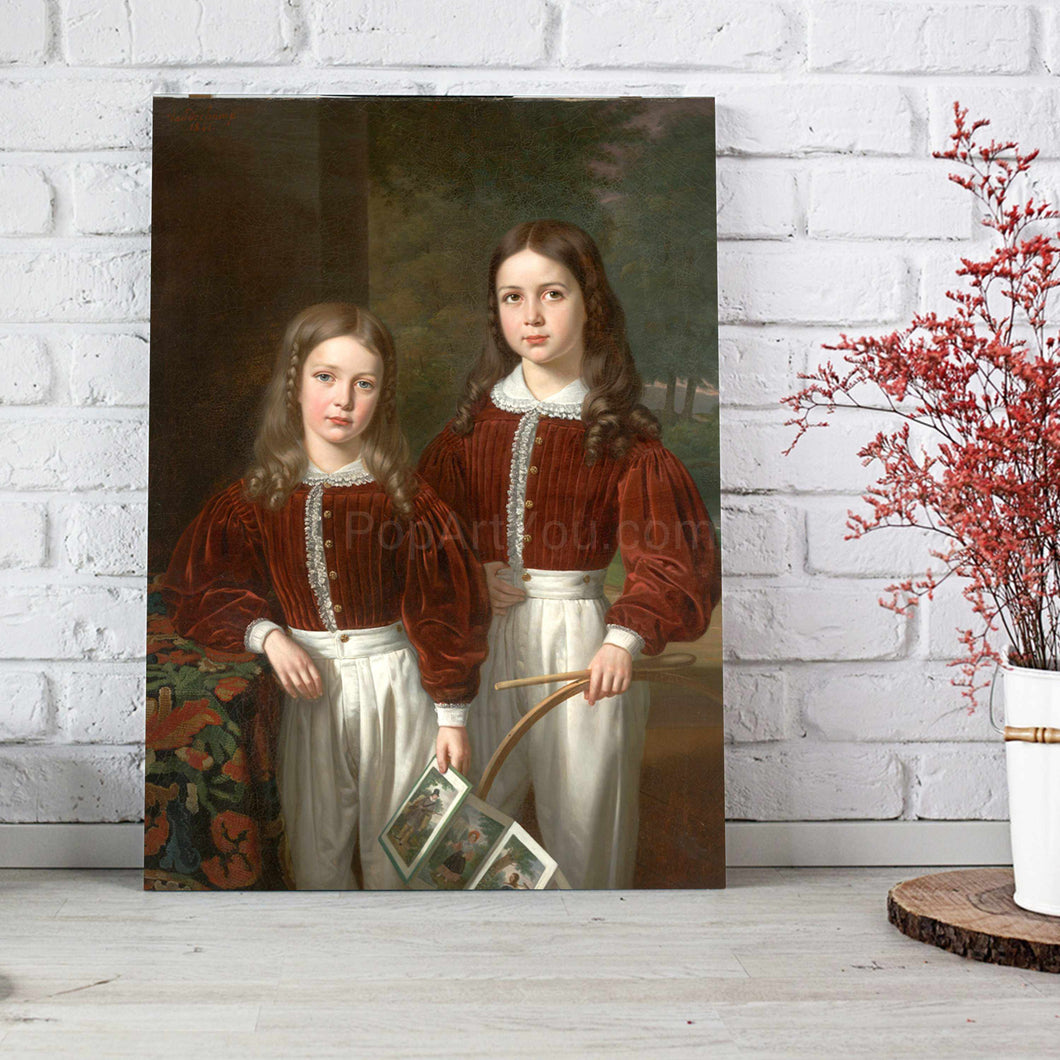 Portrait of two girls dressed in red royal clothes stands on a wooden floor against a background of a white brick wall