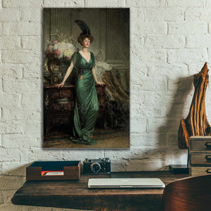 Portrait of a woman dressed in green regal attire with a hat hanging on a white brick wall above a work table