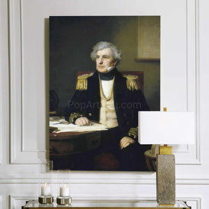 A portrait of an elderly man with white hair dressed in historical royal clothes hangs on a white wall above two candles
