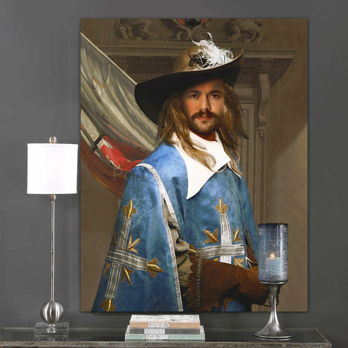 A portrait of a man in a hat dressed in renaissance royal blue clothes hangs on the gray wall next to the lamp