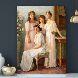 Portrait of four women dressed in white regal attires stands on a white table next to a golden vase
