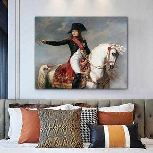 Portrait of a woman riding a white horse dressed in royal clothes with a hat hanging on a white wall above the sofa
