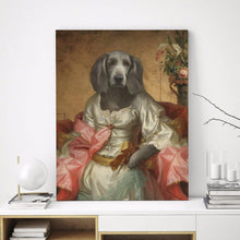 Load image into Gallery viewer, Portrait of a female dog with a human body dressed in a gray royal dress with a pink mantle stands on a white table near books
