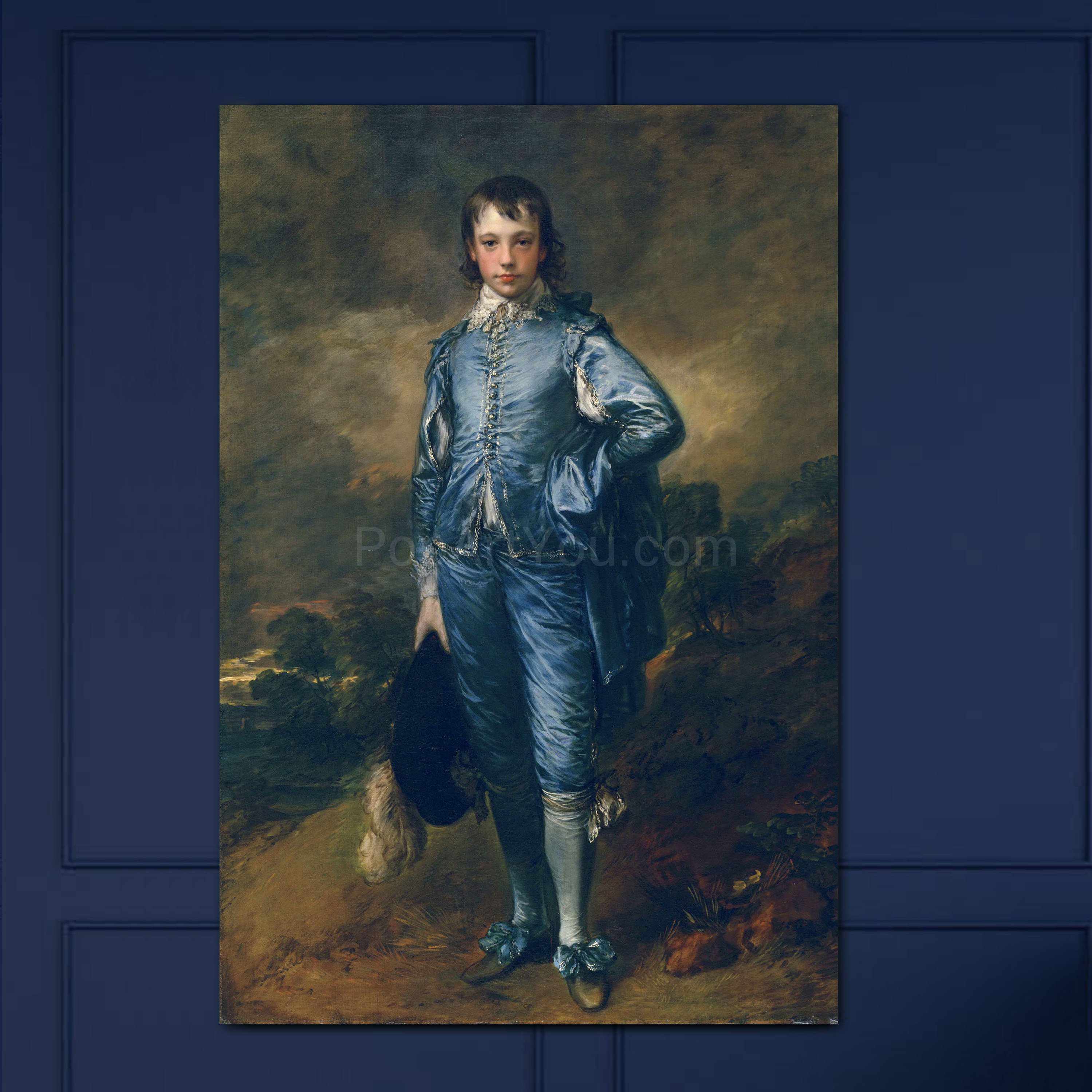 Portrait of a boy dressed in blue regal attire hanging on a blue wall