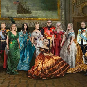 The portrait shows a large family dressed in historical regal attires standing near a large painting