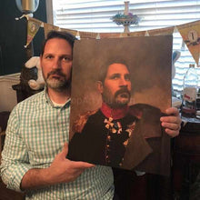 Load image into Gallery viewer, А man holding a portrait of himself dressed in a renaissance general suit
