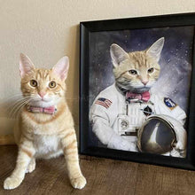 Load image into Gallery viewer, The cat sits beside himself dressed in the white clothes of an American astronaut

