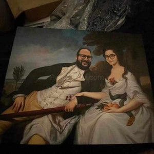The portrait shows a couple with glasses dressed in white royal clothes