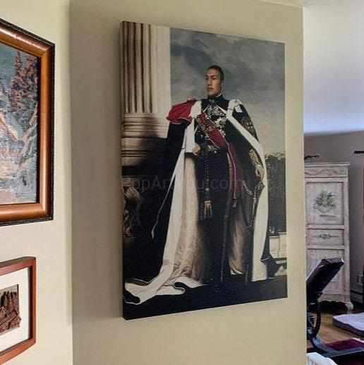 On the wall next to other paintings hangs a portrait of a man dressed in royal clothes