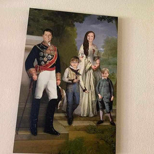 Portrait of a family walking in the woods dressed in historical regal attires hanging on a beige wall