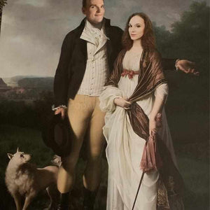The portrait shows a couple dressed in historical royal attires standing in the forest with a dog