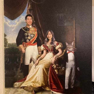 The portrait shows a young couple dressed in red royal attires standing next to a cat with a human body