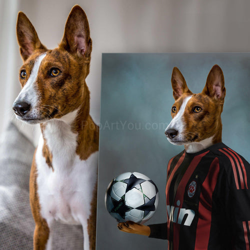 A dog stands near a portrait of himself with a human body dressed in black soccer clothes with a ball