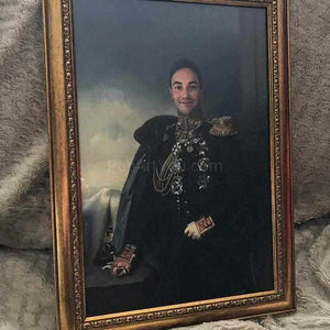 On the bed in a gold frame lies a portrait of a man dressed in a historical costume of a general-diplomat