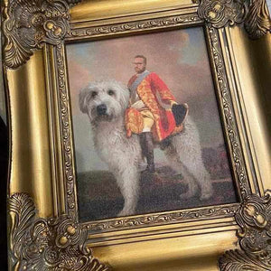 The portrait of a man dressed in regal attire sitting on a huge dog is in a gold frame