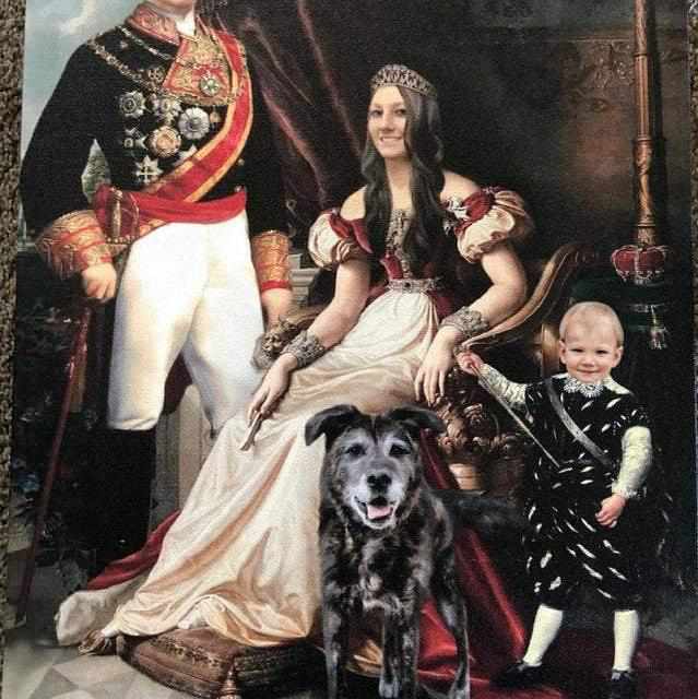 The portrait shows the royal family dressed in historical royal attires with a dog